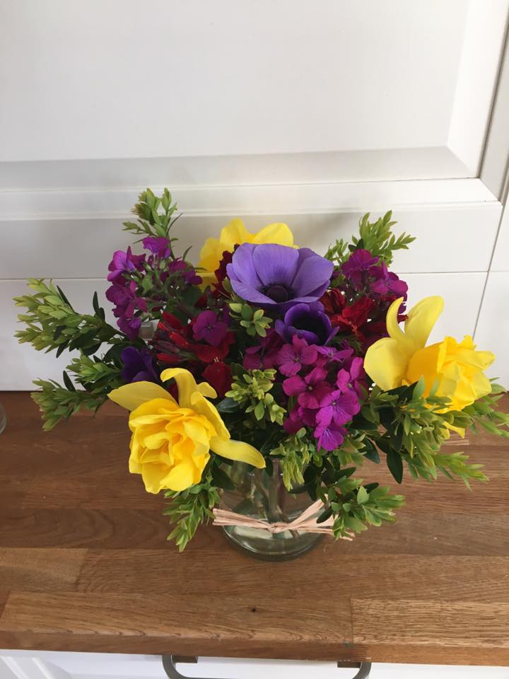 Posy flowers in a jam jar image